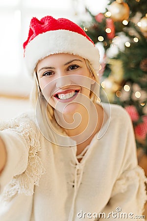 Cute, young woman with Santa's hat Stock Photo