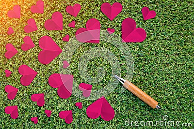 Cuted paper hearts on the grass Stock Photo