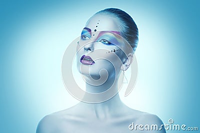 Cutie adult woman with colorful make up in cold tones Stock Photo