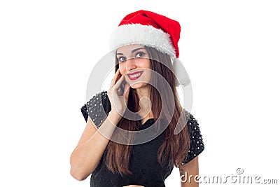 Cutie brunette girl in santa hat Stock Photo