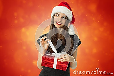 Cutie brunette woman in santa hat Stock Photo