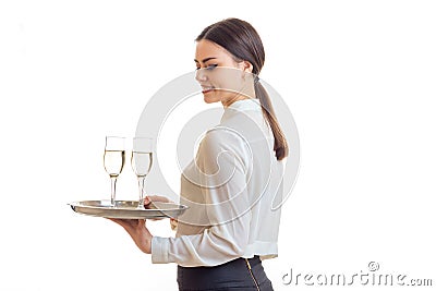 Cutie young waitress smiles and holds a trey Stock Photo