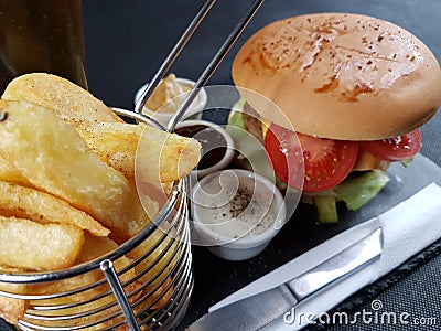 Cutlery burger sauces plate chips metalbasket Stock Photo