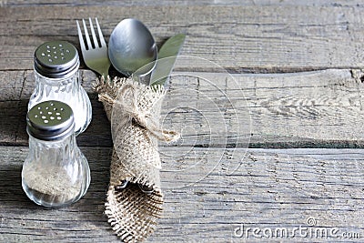 Cutlery kitchenware on old wooden boards background Stock Photo
