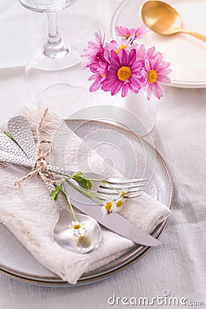 Cutlery with napkin and flower decoration - fine dining and place setting Stock Photo