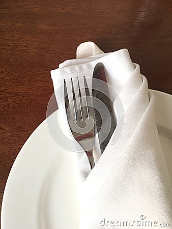 Cutlery on plate Stock Photo