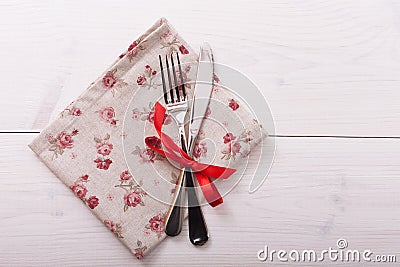 Cutlery, tablecloth on white wooden table for Stock Photo