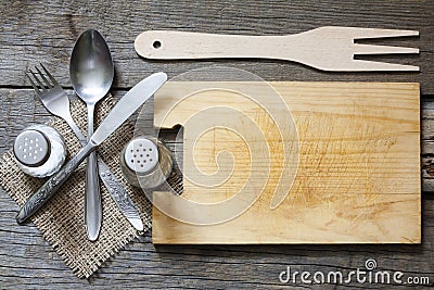 Cutlery and vintage empty cutting board Stock Photo