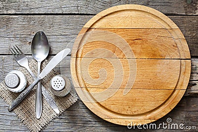 Cutlery and vintage empty cutting board food background Stock Photo