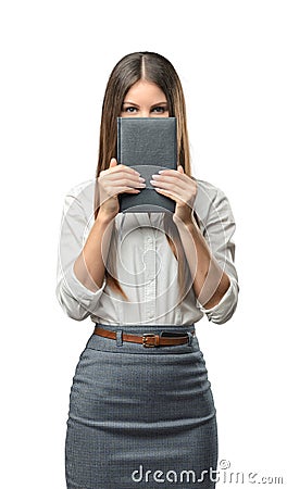 Cutout business woman holding a book and covering her face. Stock Photo