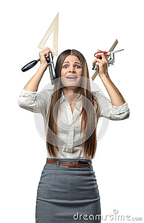 Cutout businesswoman in stress holding keeps office supplies over the head. Stock Photo