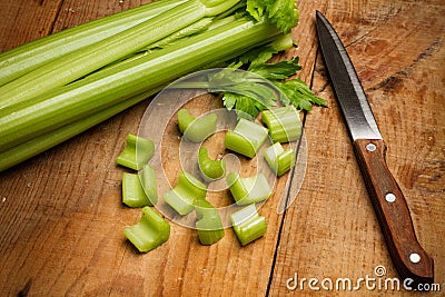 Cutted celery and a knife Stock Photo