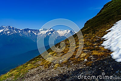 Cutting through the Alyeska Mountains in June Stock Photo