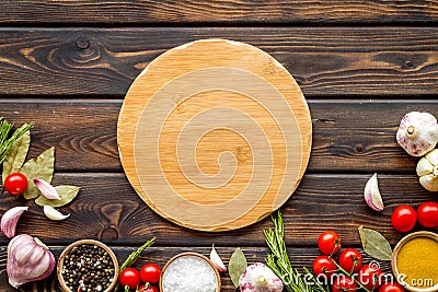 Cutting board in frame of food for chef work on wooden background top view space for text Stock Photo