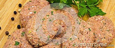 On cutting board homemade uncooked meatballs, kofte Stock Photo