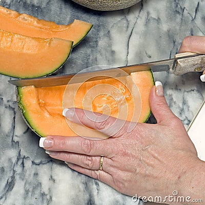 Cutting cantaloupe sequence 4 Stock Photo