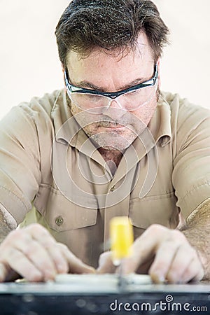 Cutting Ceramic Tile Stock Photo