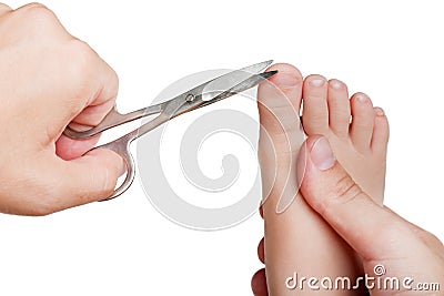 Cutting child toenail Stock Photo