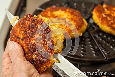 Cutting the cooked corn bread Stock Photo