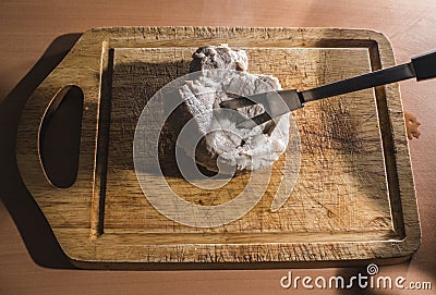 Cutting cooked meat Stock Photo