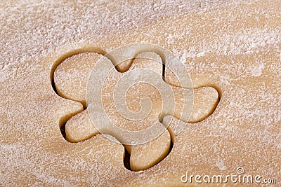 Cutting cookies dough gingerbread man shape Stock Photo