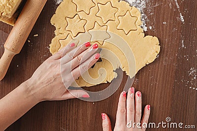 Cutting cookies dough star shape homemade for christmas Stock Photo