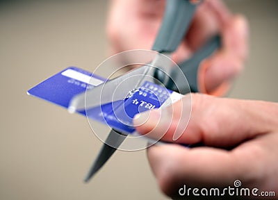 Cutting a credit card Stock Photo