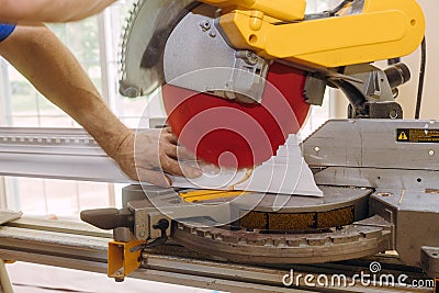 Cutting crown moulding for renovation new house under construction in the finishing work Stock Photo