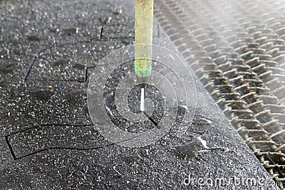 Cutting decorative materials with water on CNC machines Stock Photo