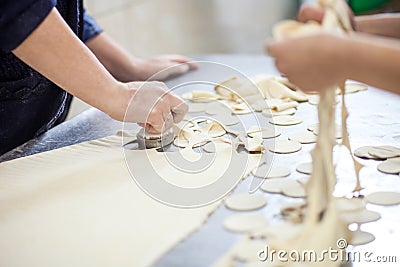 Cutting dough for dumplings Stock Photo