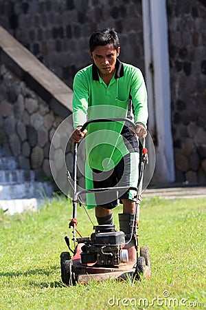 Cutting grass Editorial Stock Photo