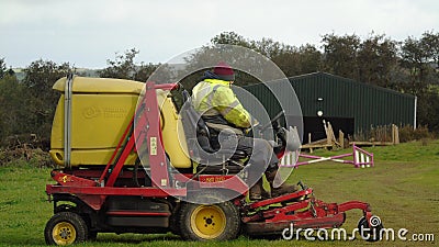 Cutting the grass Editorial Stock Photo