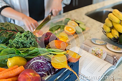 Cutting healthy fruits and vegetables for a recipe Stock Photo