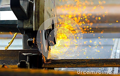 Cutting of iron steel TMT bars with motorised steel cutter and generation of sparks Stock Photo