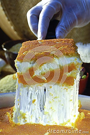 Cutting Kunafa or Kinafa, Arabic Sweets with Cheese for Ramadan a Stock Photo