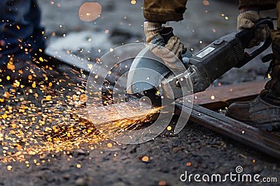 Cutting metal with angle grinder. Stock Photo