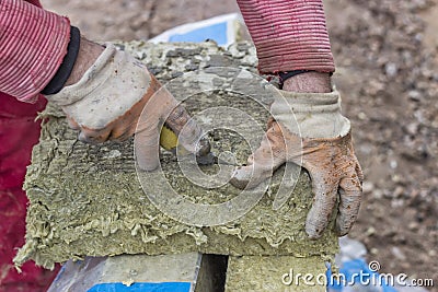 Cutting mineral wool panel with a craft knive 3 Stock Photo