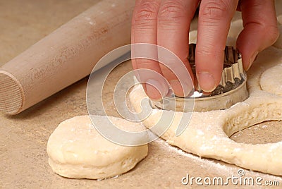 Cutting out buttermilk biscuit dough Stock Photo