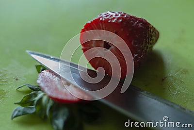 Cutting Strawberry with knife process 1 of 6 Stock Photo