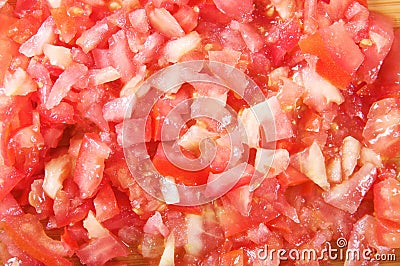 Cutting Tomatoes on a cutting board Stock Photo