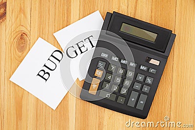 Cutting your monthly budget with a calculator and word budget cut Stock Photo