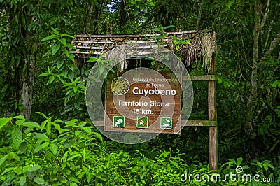 CUYABENO, ECUADOR - NOVEMBER 16, 2016: An informative wooden sign about the Cuyabeno National Park, depth of Amazon Editorial Stock Photo