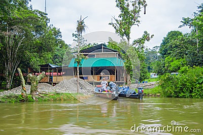 CUYABENO, ECUADOR - NOVEMBER 16, 2016: Unidentified man on a boat in the Cuyabeno river, depth of Amazon Jungle in Editorial Stock Photo