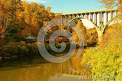 Cuyahoga Valley Scenic Railroad train under bridge overpass Stock Photo