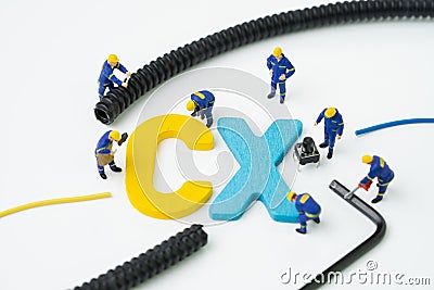 CX, Customer Experience concept, miniature figure worker building alphabet CX at the center, important of customer centric Stock Photo