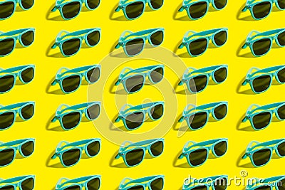 Cyan, aqua menthe sunglasses pattern isolated on background of yellow color. Stock Photo
