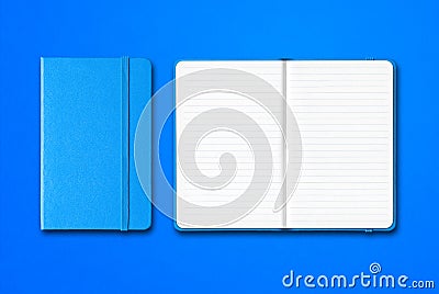 Cyan closed and open lined notebooks isolated on blue background Stock Photo