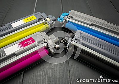 Cyan, magenta, amariyllo and black color toner rollers of a foreground color laser printer Stock Photo