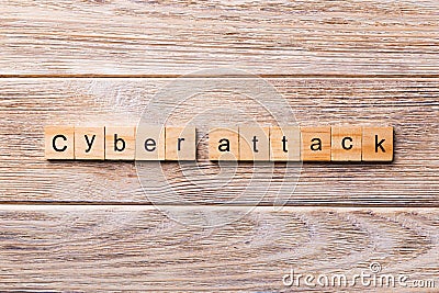 Cyber attack word written on wood block. Cyber attack text on wooden table for your desing, concept Stock Photo