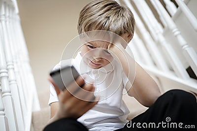 Cyber bullying by phone text message Stock Photo